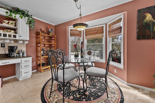 124 Muirfield Dr, Kings Mountain, NC 28086 - dining space featuring a textured ceiling, crown molding, baseboards, and light tile patterned floors