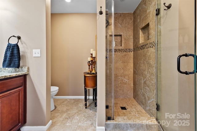 124 Muirfield Dr, Kings Mountain, NC 28086 - bathroom with a shower stall, vanity, baseboards, and toilet