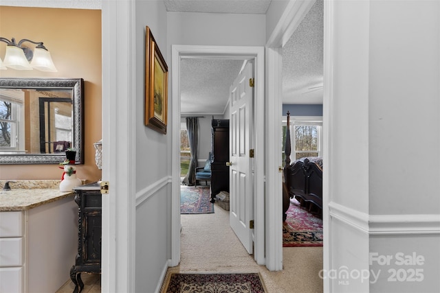 124 Muirfield Dr, Kings Mountain, NC 28086 - hallway featuring a textured ceiling and carpet