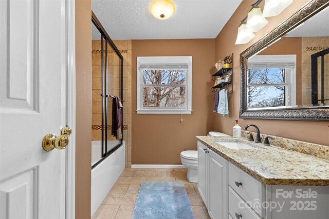 124 Muirfield Dr, Kings Mountain, NC 28086 - bathroom with baseboards, vanity, toilet, shower / bath combination with glass door, and a textured ceiling