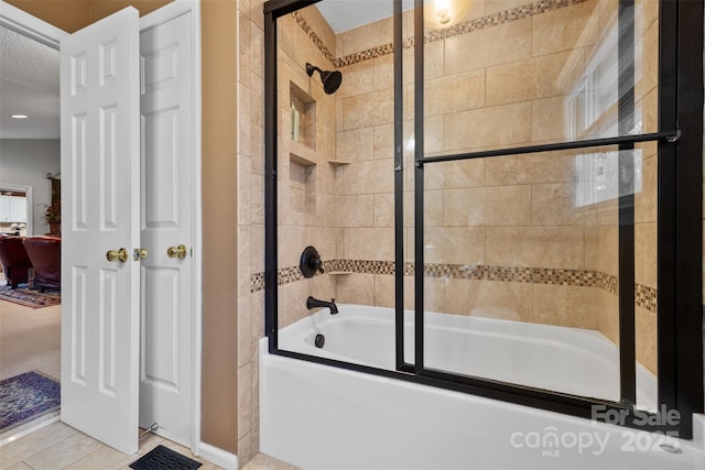 124 Muirfield Dr, Kings Mountain, NC 28086 - ensuite bathroom with shower / bath combination with glass door and tile patterned floors