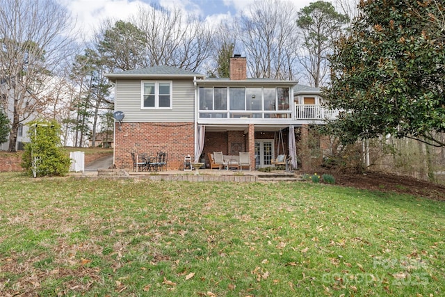 124 Muirfield Dr, Kings Mountain, NC 28086 - back of house with a sunroom, brick siding, a chimney, a patio, and a lawn
