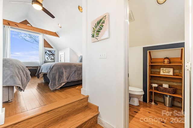 bedroom featuring lofted ceiling, wood-type flooring, and ceiling fan