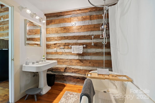 bathroom with hardwood / wood-style floors