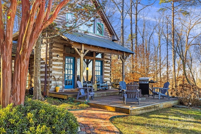 wooden terrace with area for grilling