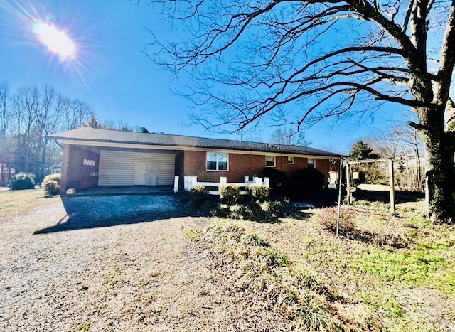 single story home featuring a carport