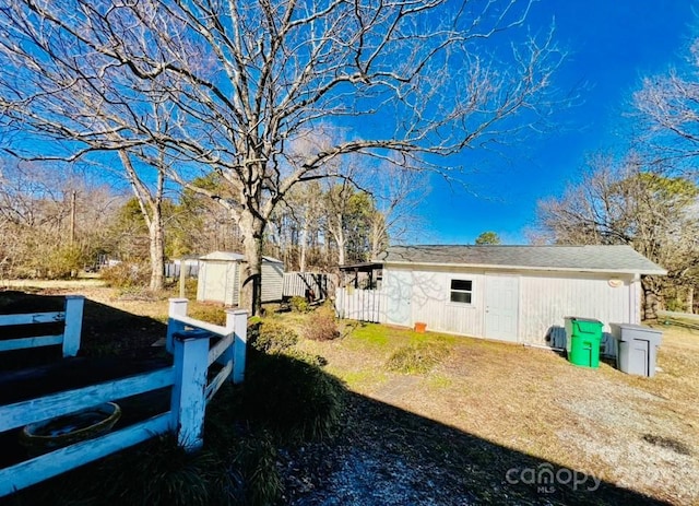 view of home's exterior with a storage unit