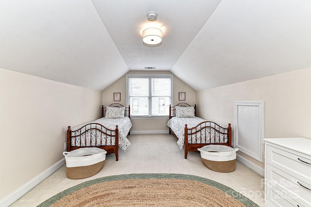 bedroom with lofted ceiling and carpet flooring