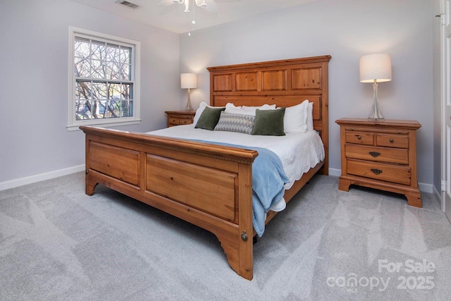 bedroom with light carpet and ceiling fan