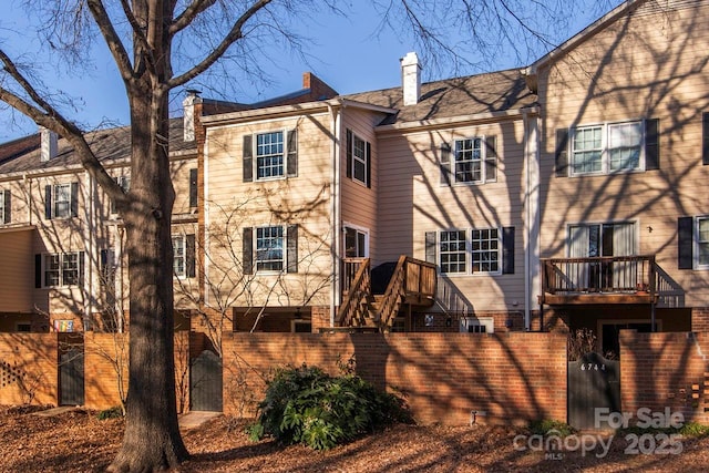 back of house with a balcony