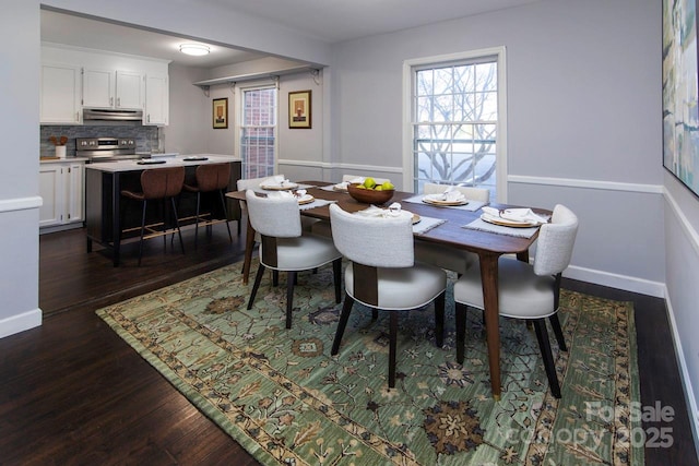 dining room with dark wood-type flooring