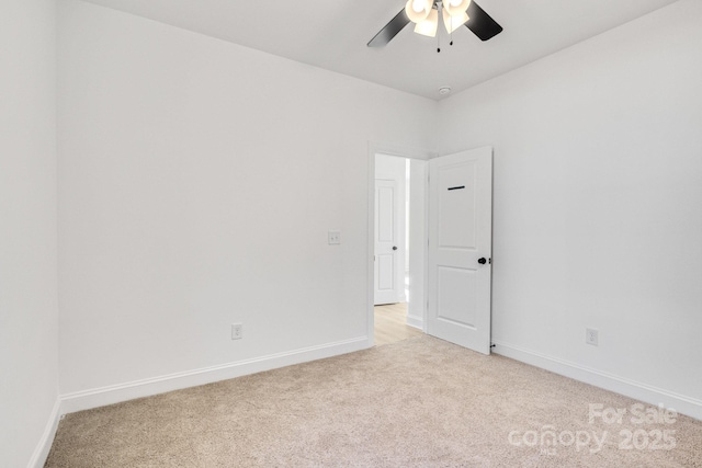 unfurnished room featuring ceiling fan and light colored carpet