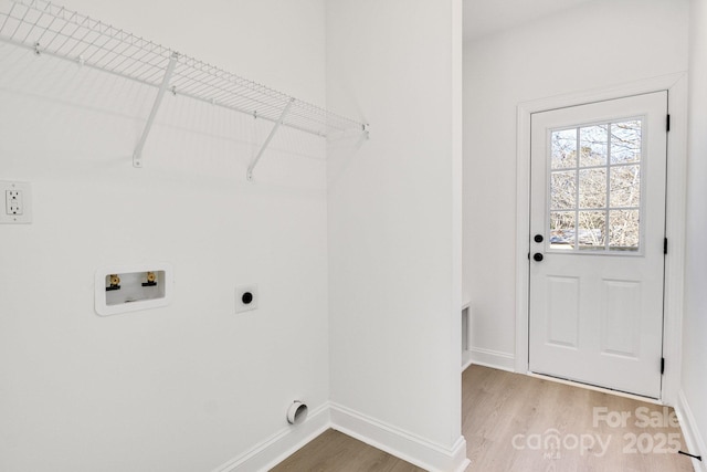 clothes washing area with washer hookup, hookup for an electric dryer, and hardwood / wood-style floors