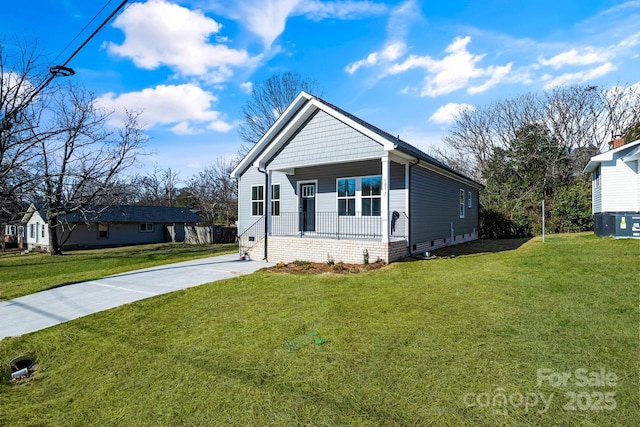 view of front of home with a front yard and a porch