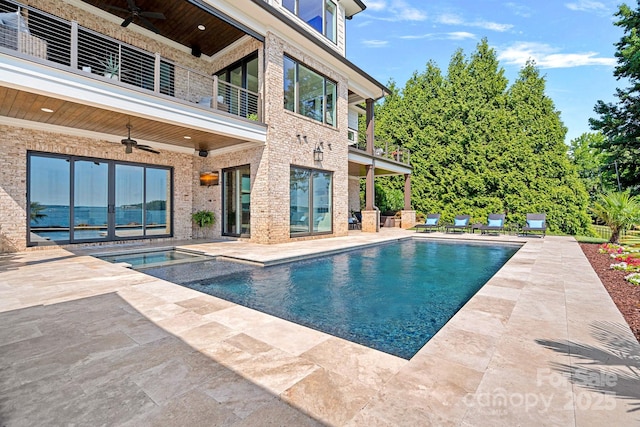 view of pool featuring a patio area and ceiling fan