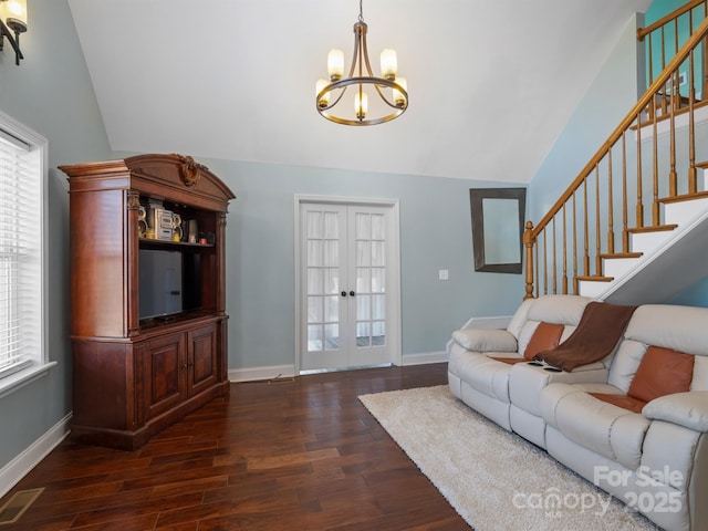 living room with baseboards, dark wood-style floors, stairway, vaulted ceiling, and french doors