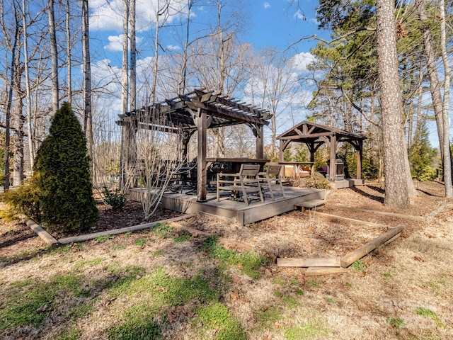 view of yard with a gazebo, a pergola, and a wooden deck