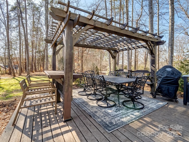 wooden deck with a pergola and grilling area