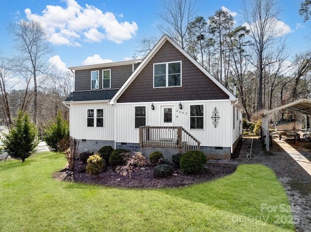 view of front of house featuring a shingled roof, a front yard, crawl space, a carport, and driveway