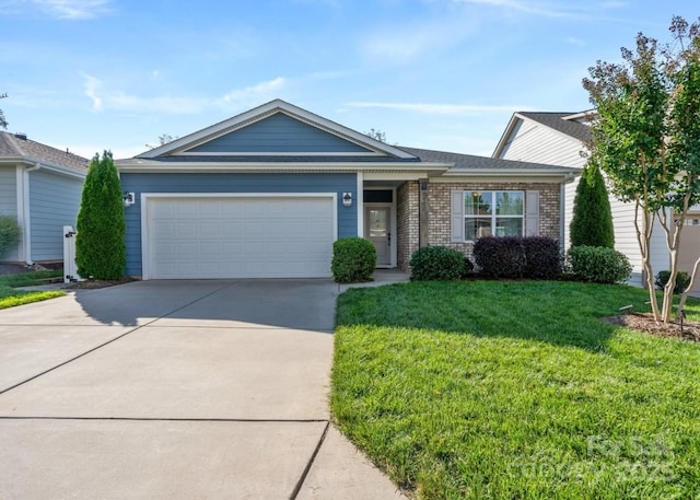 ranch-style house featuring a front lawn and a garage