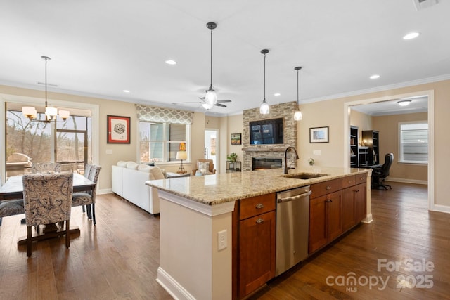 kitchen with ceiling fan with notable chandelier, pendant lighting, sink, a kitchen island with sink, and stainless steel dishwasher