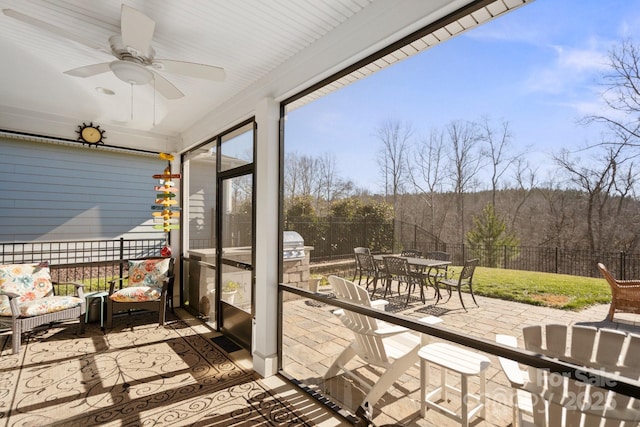 balcony with ceiling fan and a patio area