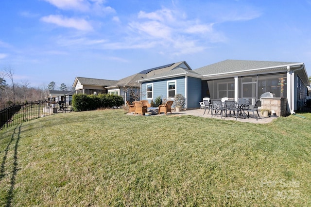 back of property with a patio area, outdoor lounge area, a yard, and a sunroom