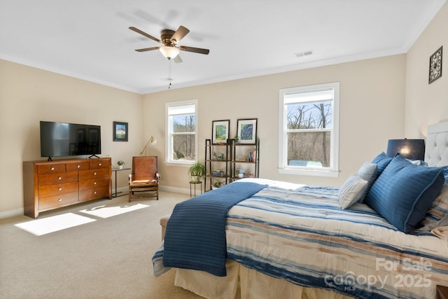 bedroom with ceiling fan, carpet, and crown molding