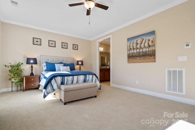 carpeted bedroom featuring ceiling fan, ornamental molding, and ensuite bath