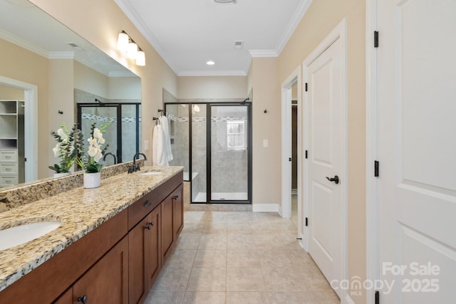 bathroom featuring a shower with shower door, vanity, tile patterned flooring, and ornamental molding