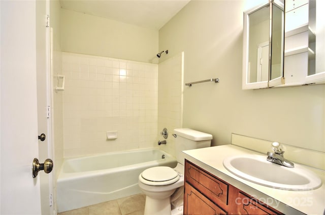 full bathroom with tile patterned flooring, vanity, toilet, and tiled shower / bath