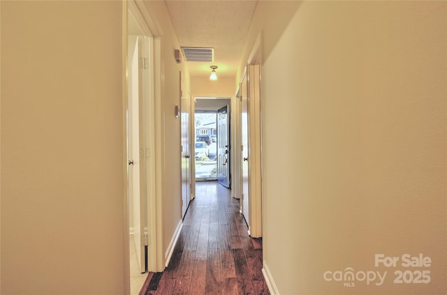 hall featuring dark wood-type flooring