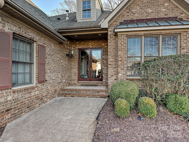 property entrance featuring french doors and a patio