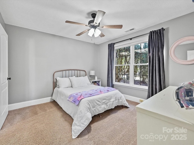 bedroom with ceiling fan and carpet floors