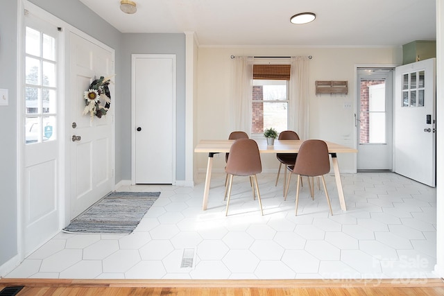 tiled dining room with a wealth of natural light