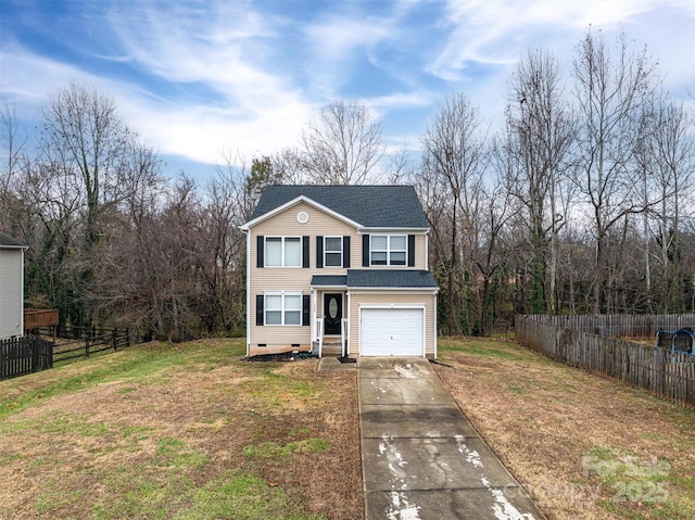 view of front property featuring a garage and a front yard