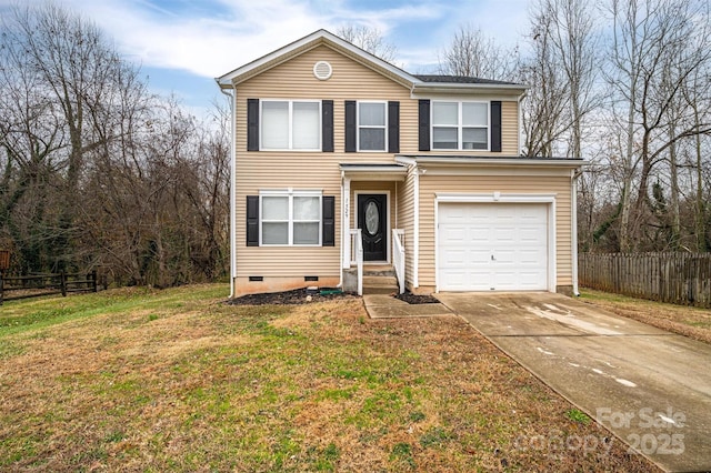 front of property with a front yard and a garage