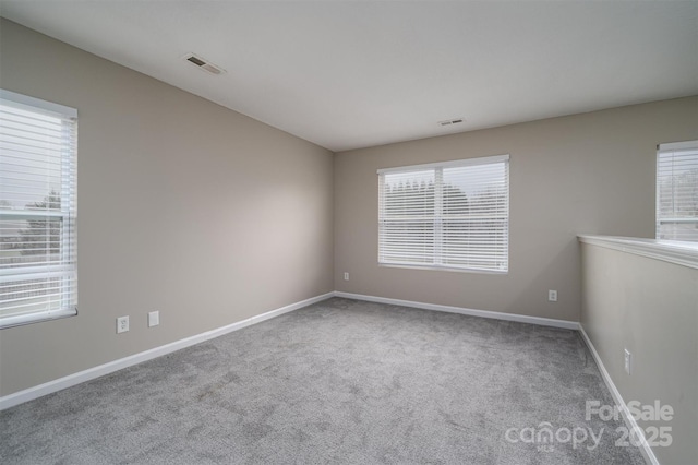 empty room featuring carpet floors