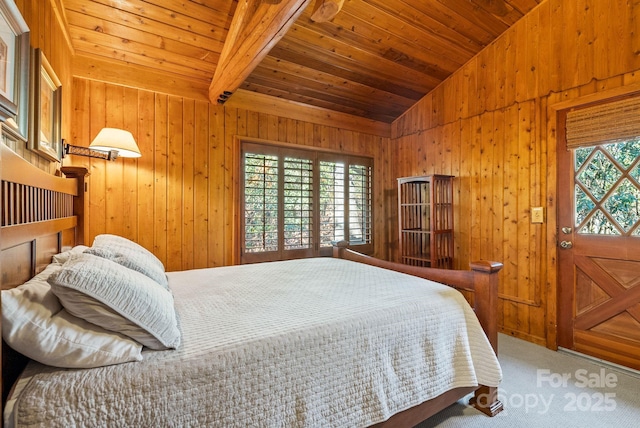 carpeted bedroom with lofted ceiling with beams, wood walls, and wood ceiling