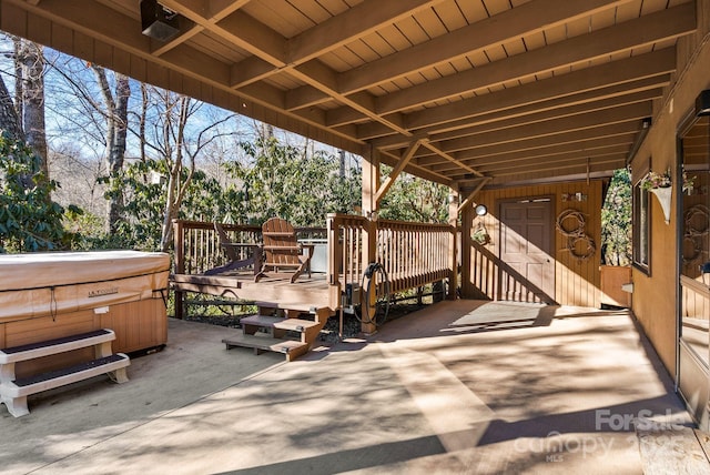 view of patio / terrace with a hot tub