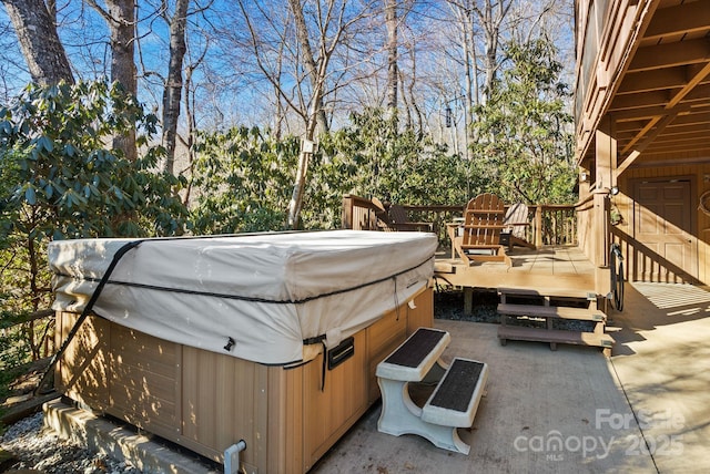 view of patio / terrace with a hot tub