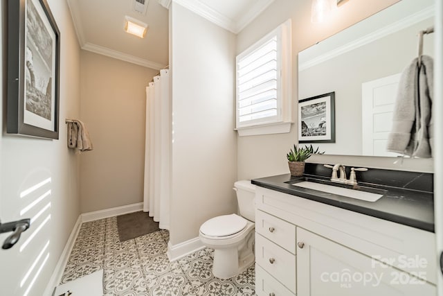 bathroom with toilet, vanity, tile patterned floors, and crown molding