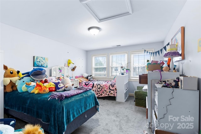 carpeted bedroom featuring attic access