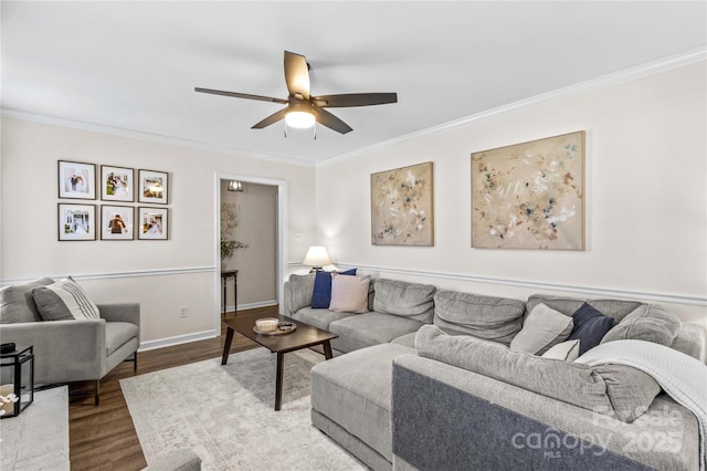 living room featuring ceiling fan, wood-type flooring, and ornamental molding