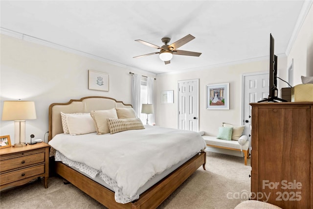 bedroom featuring ceiling fan, light colored carpet, and ornamental molding