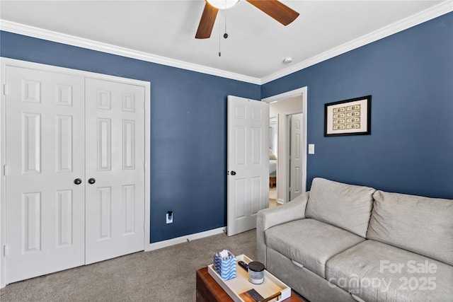 carpeted living room featuring ceiling fan and ornamental molding