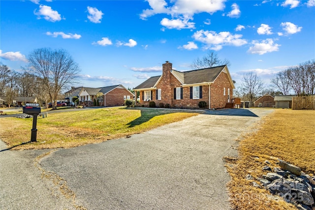 ranch-style house with a front lawn