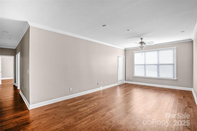 spare room with ceiling fan, ornamental molding, and dark hardwood / wood-style floors