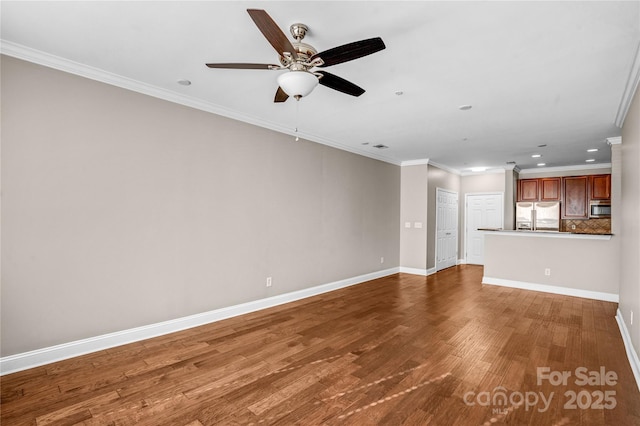 unfurnished living room featuring ceiling fan, hardwood / wood-style flooring, and crown molding