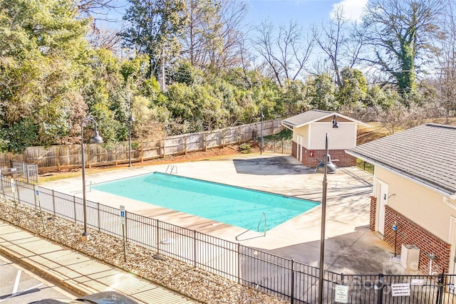 view of swimming pool with a patio